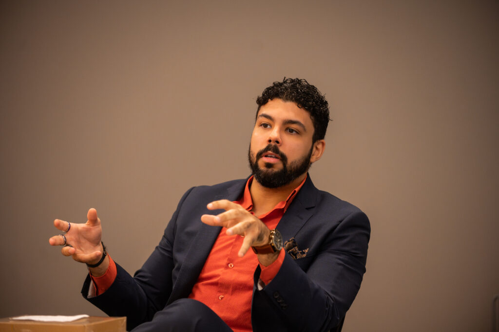 man speaks on panel