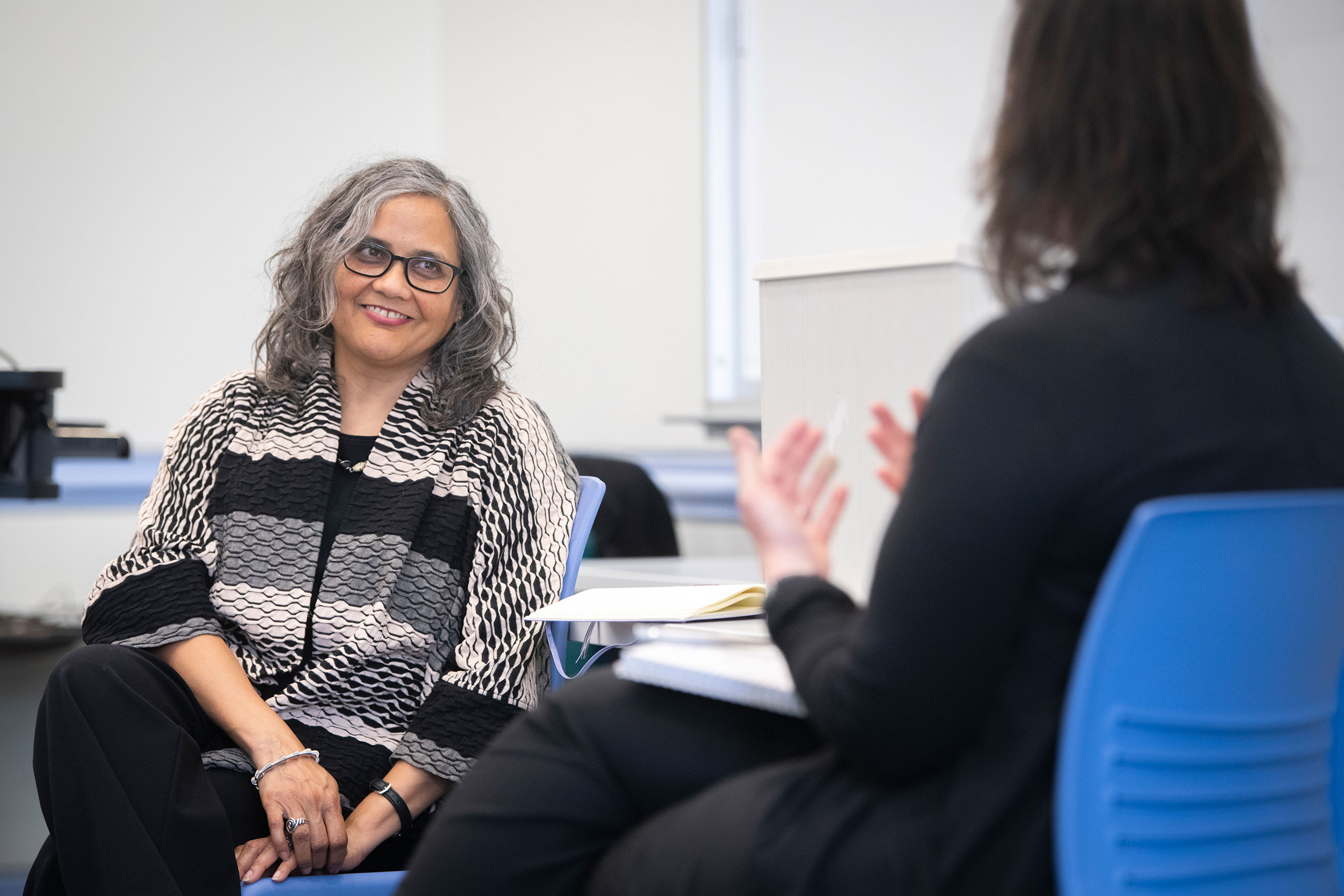 Pronita Gupta ‘91, left, speaks with Margaret Post‘s class.