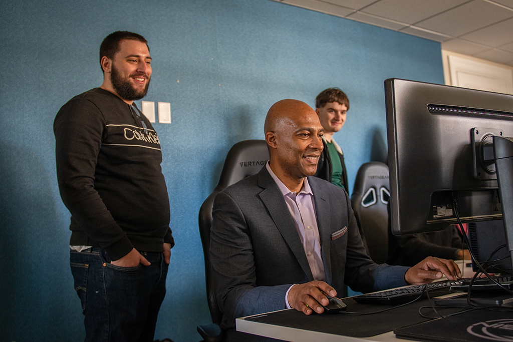 Stanley Pierre-Louis ’92 tries out one of the games designed by BSDT students.
