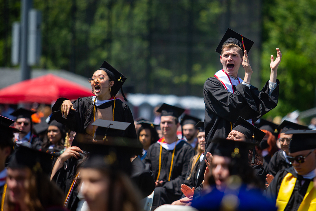 Students cheering at Clark University Commencement