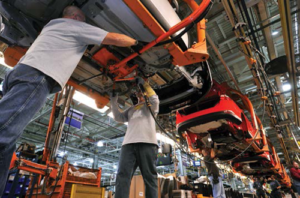 People working in a car factory