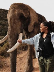 Marissa Callender petting elephant's tusk