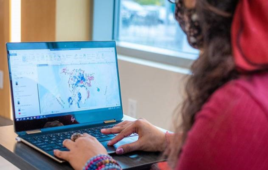 Student working on project on laptop