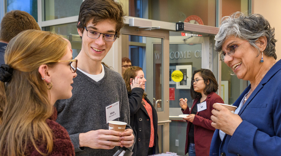 Clark students talking with professor