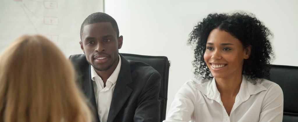 employer shaking hand with employee