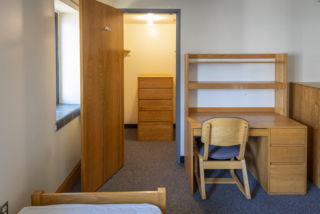 Maywood Hall dorm room with desk and closet