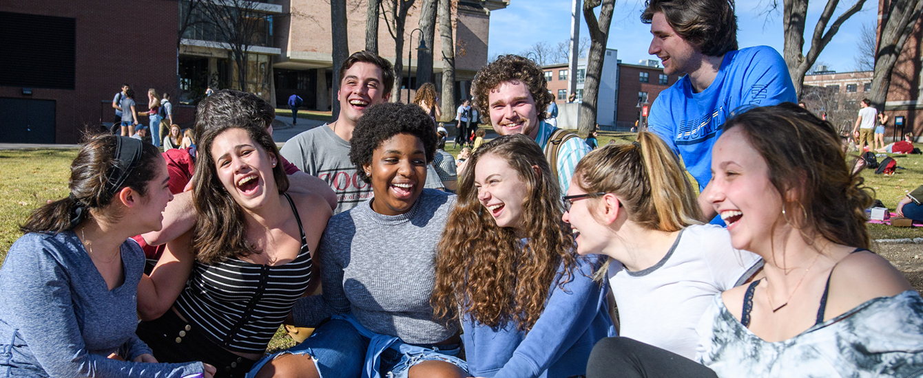 Students on green laughing