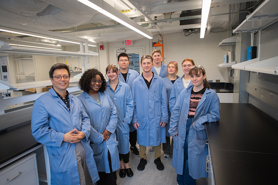 chemistry students with faculty member