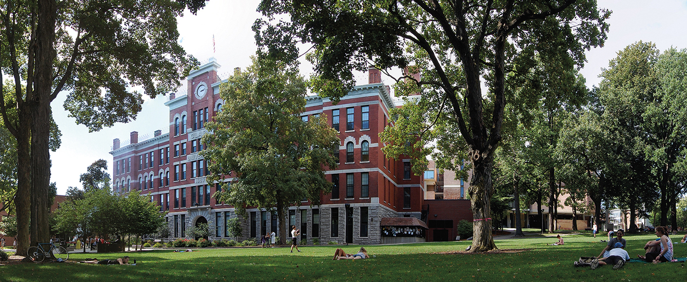 jonas clark building with students sitting on the gree