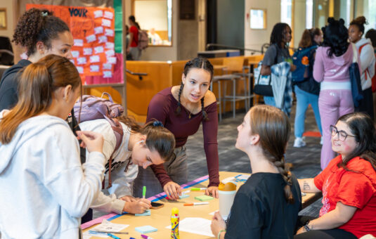 a group of people at a table talking