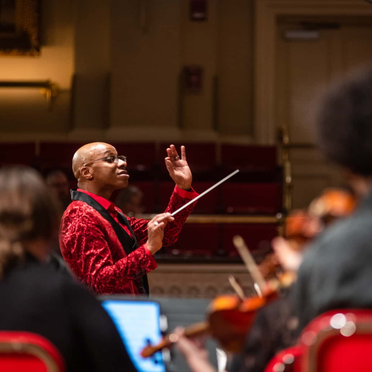 Cailin Marcel conducts a concert
