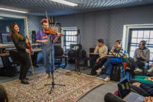 students working in a recording studio