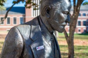 Freud statue boasting an "I voted" sticker