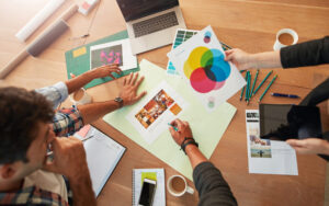 marketing professionals looking over graphics and ad spaces