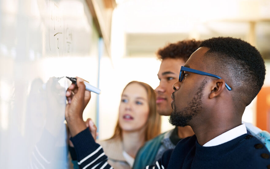 Mathematics Education students writting on whiteboard