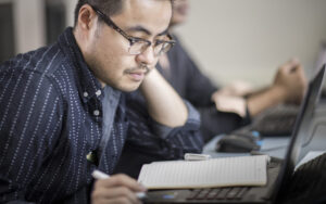 A student studies with a book