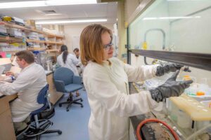 A student working in the chemistry lab, Clark University