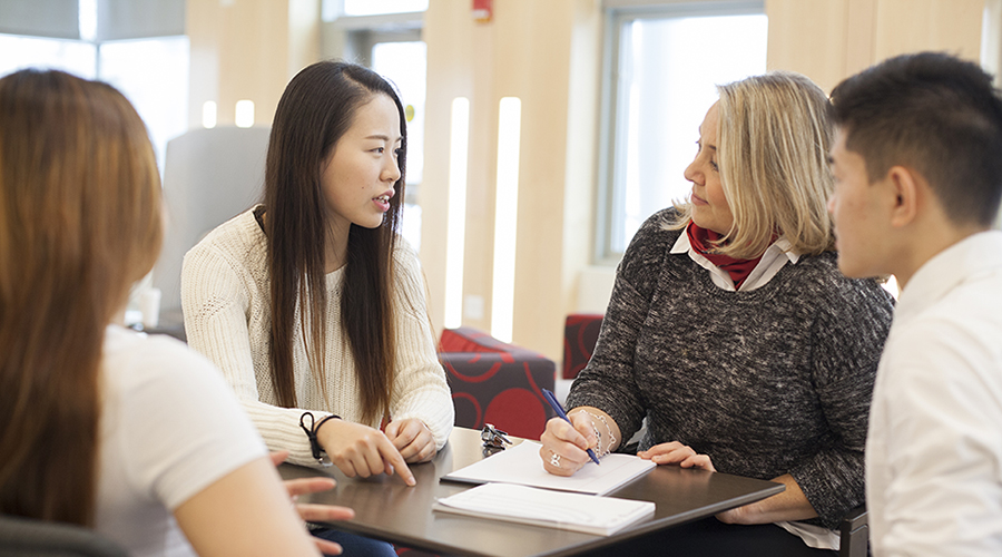 students talking to counselor