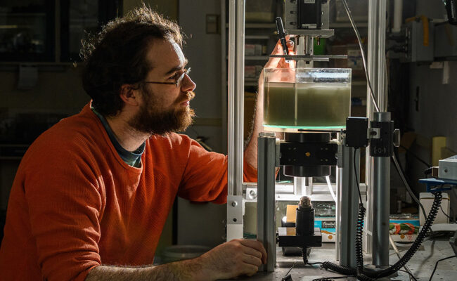 Physics student with equipment