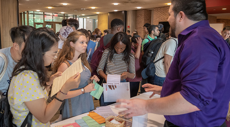 Graduate students at postering session