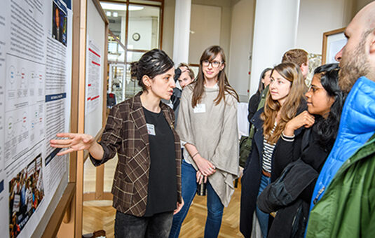 Graduate students at postering session