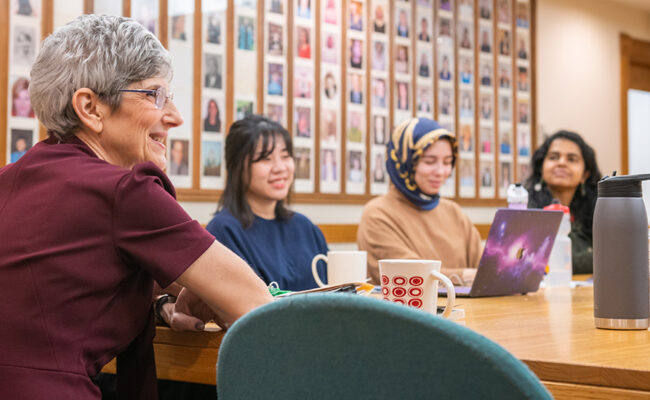 Professor meeting with students