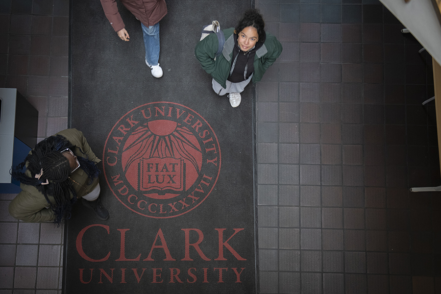 clark mat with student walking over it.