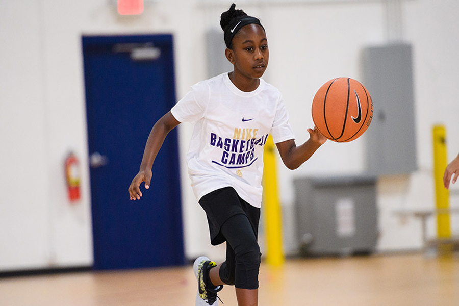 nike basketball camp - girl playing basketball