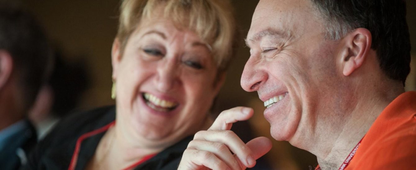 alumni members laughing