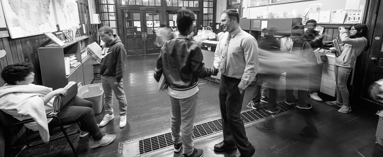 Student and principal in University Park Campus School hallway