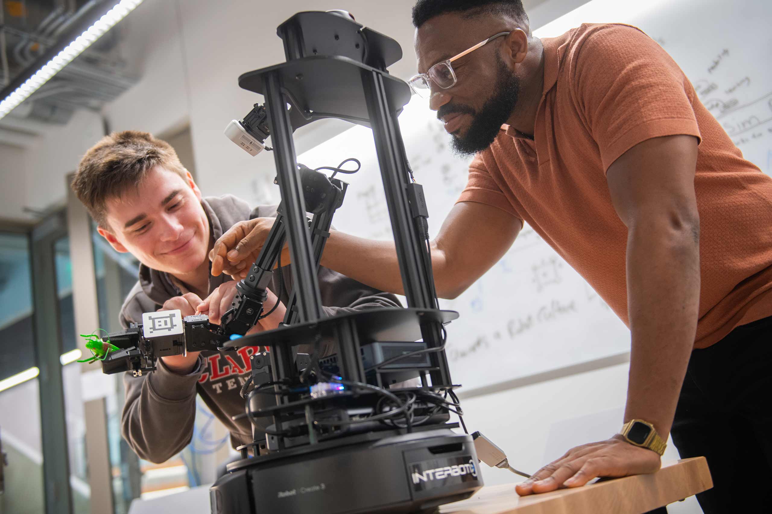 Students work together in the robotics lab