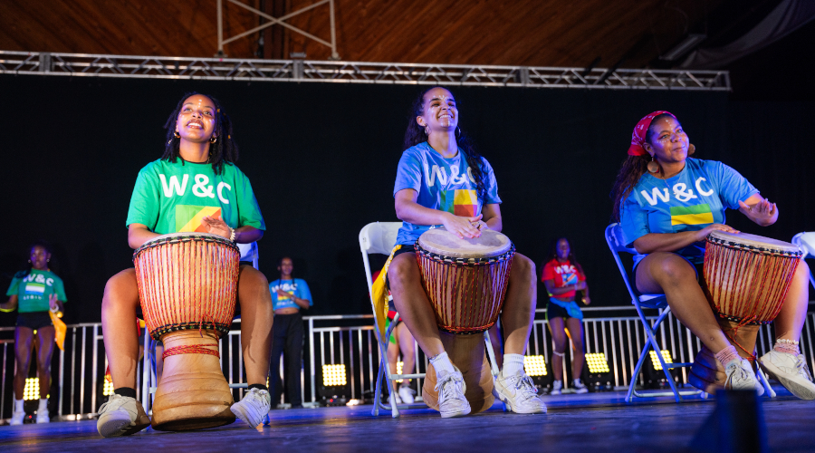 Students playing bongo drums at Gala 2024