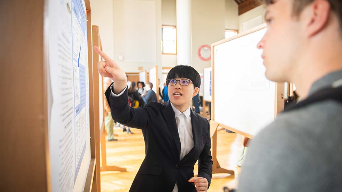 A student presenting their capstone project research at ClarkFest