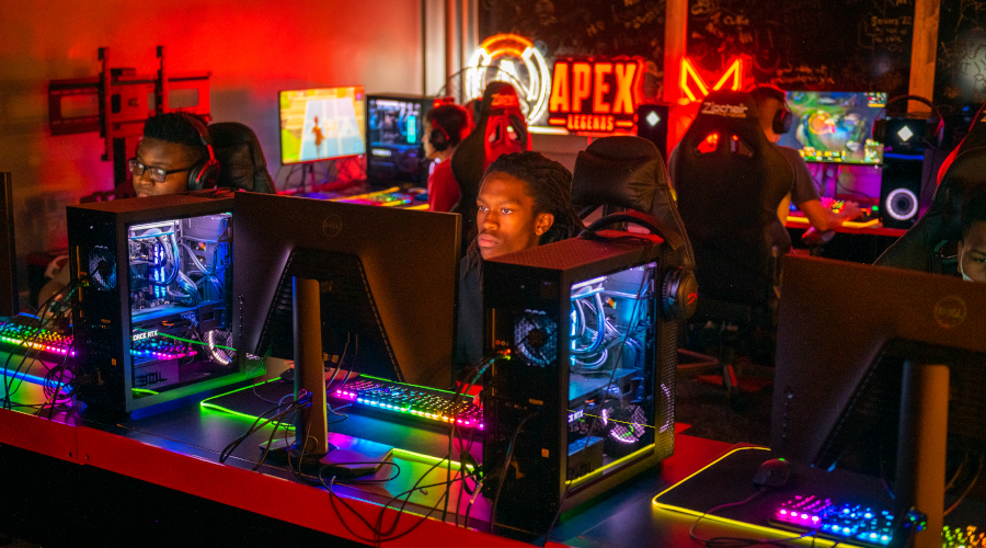 Student looking at gaming computer at Clark esports summer camp