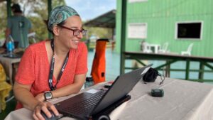 Florencia Sangermano works at a computer analyzing ecoacoustic data in Brazil