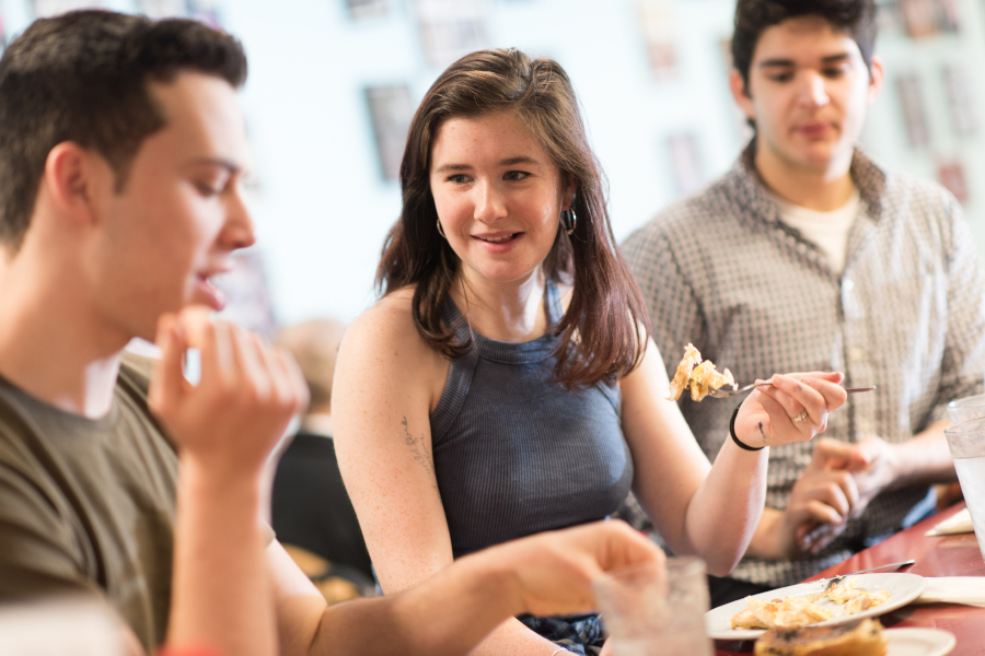 Students eating at Annie's Clark brunch