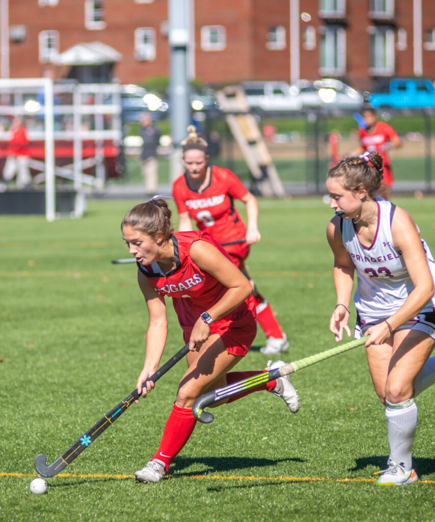Women's field hockey team competing against Springfield College