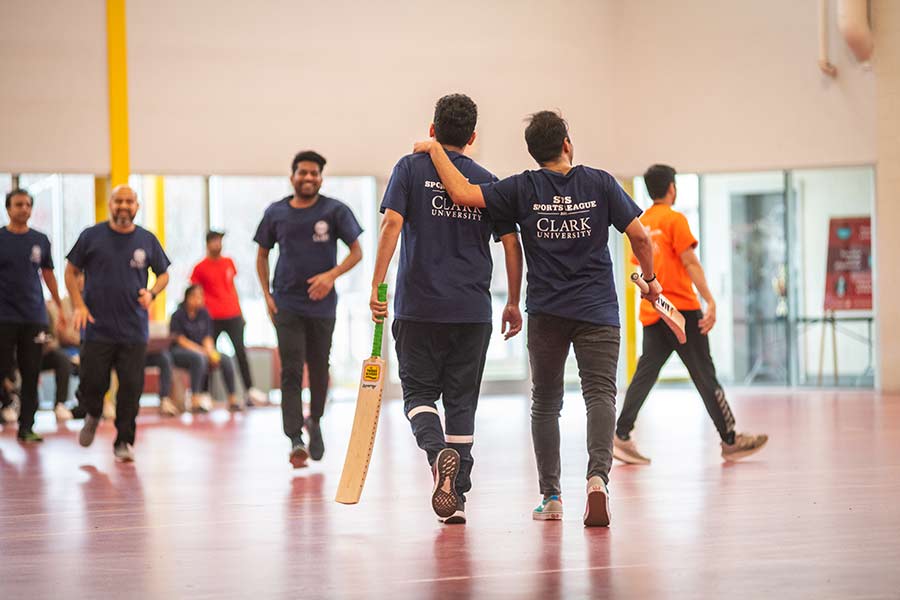 Student teams changing places during a cricket game
